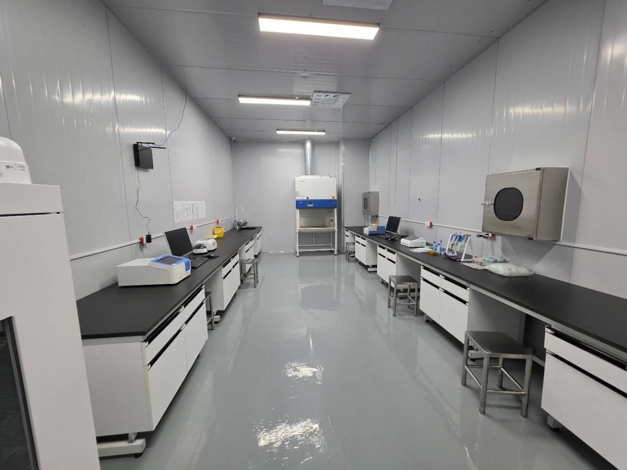 High Hope Vet laboratory interior with workbenches on both sides of a central aisle